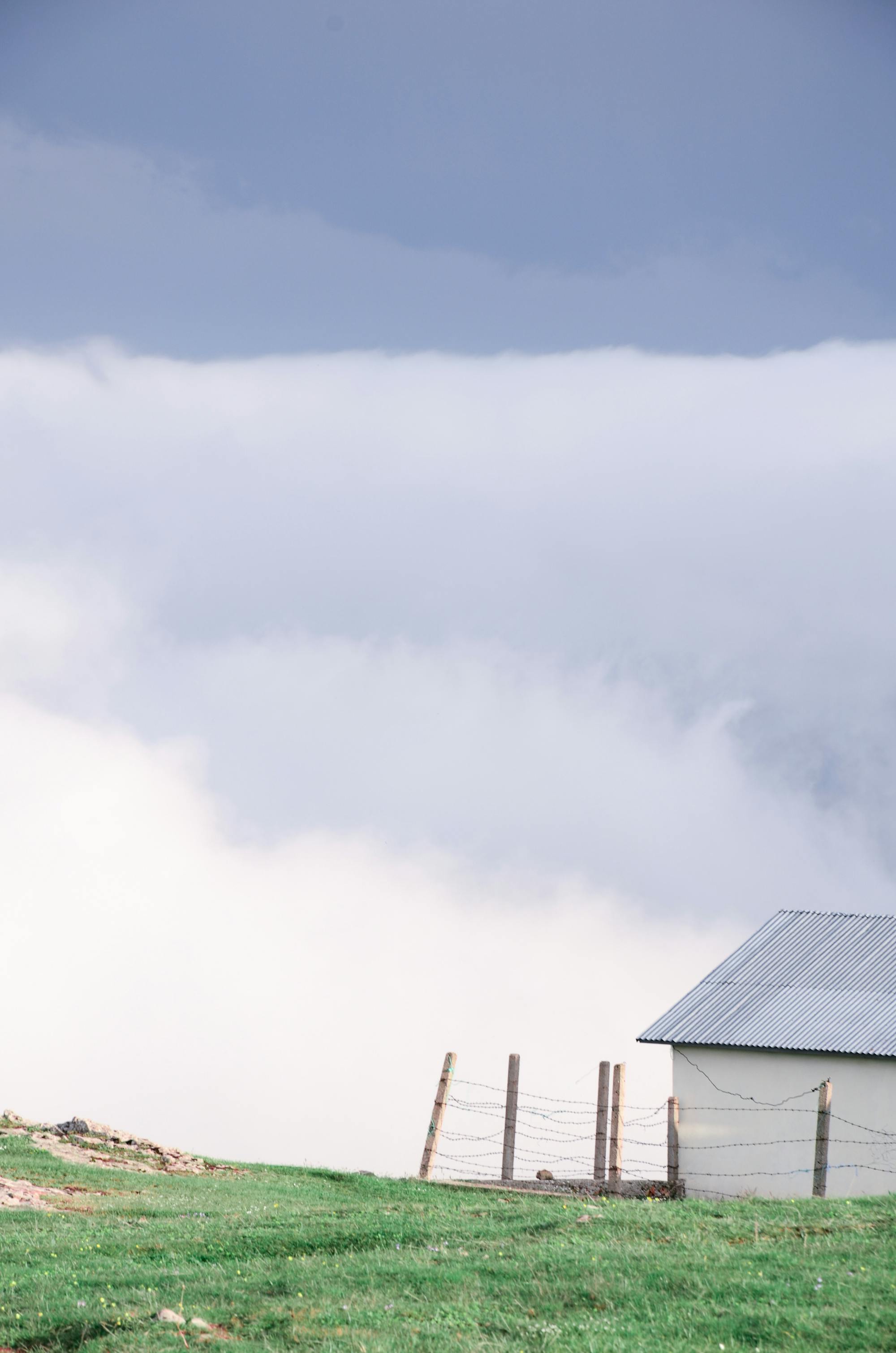 Metal roofed home under a wide sky